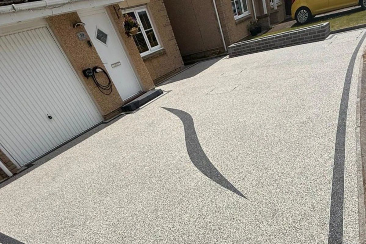 Residential driveway with resin aggregate surface